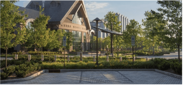 Darker colored pavers marked parking spaces and accessible parking delineation